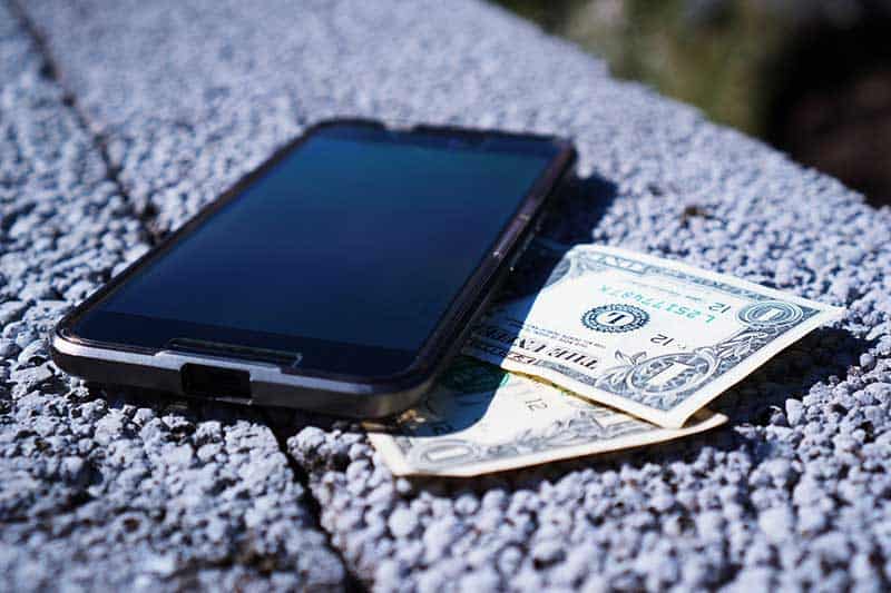 bills and smartphone
